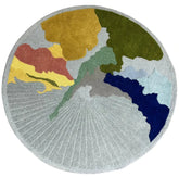 Round abstract hand-tufted wool rug in multi-color design.